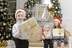 Happiness boy with x-mas gift box and smiling children