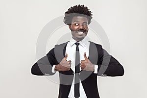 Happiness businessman looking at camera and thumbs up.