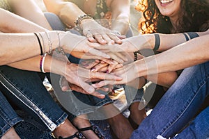 Happiness and cheerful lifestyle for team concept girls putting hands together for forever friends - happiness and friendship