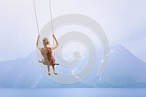 Happiness concept, happy girl child on the swing