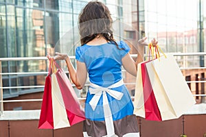 Happiness, consumerism, sale and people concept - woman with shopping bags