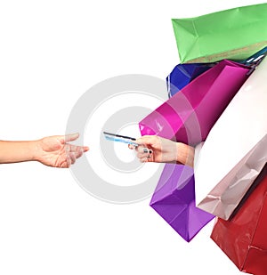 Happiness, consumerism, sale and people concept. Woman with shopping bags and debit card.