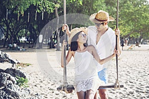 Happiness couple in romantic scene on the beach at sunset. Love and valentine concept