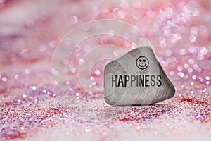 Happiness engrave on stone