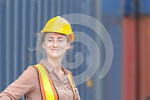 Happiness Female engineer in hardhat and safety vest, Smiling factory worker woman at container cargo