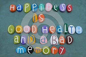 Happiness is good health and a bad memory, lifestyle quote composed with multi colored stone letters