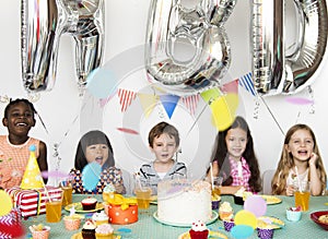 Happiness group of cute and adorable children having birthday pa