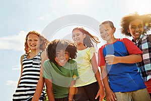 Happiness is having the greatest friends ever. Portrait of a group of diverse and happy kids hanging out together on a