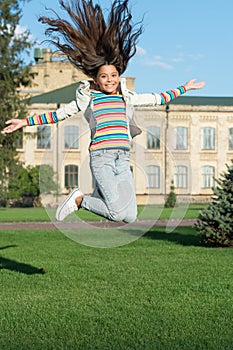 Happiness and joy. Childhood happiness. Smart small happy girl ready to study. fashion and beauty. Carefree and cheerful