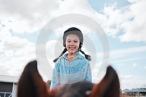 For happiness, just add a horse. an adorable little girl riding a horse.