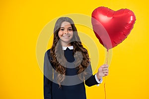 Happiness kids and love concept. Romantic lovely teen girl with red heart balloon, world heart day, happy valentines day