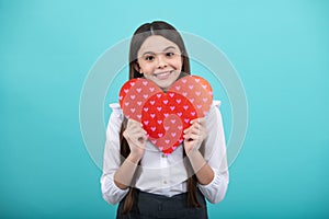 Happiness kids and love concept. Romantic lovely teen girl with red heart, world heart day, happy valentines day.