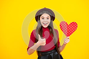 Happiness kids and love concept. Romantic lovely teen girl with red heart, world heart day, happy valentines day