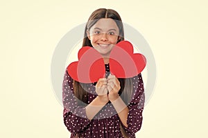 Happiness kids and love concept. Romantic lovely teen girl with red heart, world heart day, happy valentines day