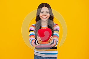 Happiness kids and love concept. Romantic lovely teen girl with red heart, world heart day, happy valentines day. Happy