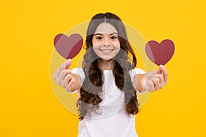 Happiness kids and love concept. Romantic lovely teen girl with red heart, world heart day, happy valentines day. Happy