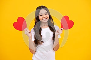 Happiness kids and love concept. Romantic lovely teen girl with red heart, world heart day, happy valentines day. Happy