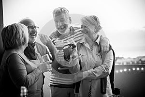 Happiness with laugh and smiles for beautiful caucasian grandfathers senior outdoor on the terrace. nice view of the city and photo