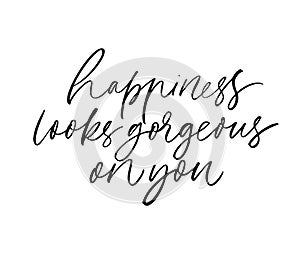Happiness looks gorgeous on you ink brush vector calligraphy. Romantic phrase handwritten brush lettering.