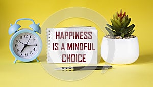 Happiness is a mindful choice - text on notepad