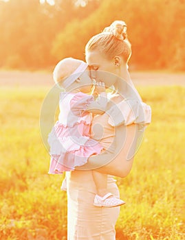 Happiness mother! Sunny portrait of happy mom and baby together