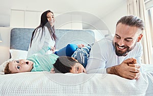 Happiness, smile and family being playful in the bedroom together of their modern house. Happy, love and excited