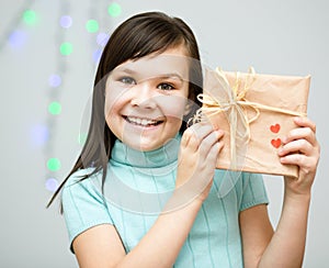 Happiness - smiling girl with present