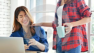 Happiness two women working together confident team meeting in office desk. Team business partners working with computer laptop