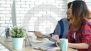 Happiness two women working together confident team meeting in office desk. Team business partners working with computer laptop st