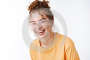 Happiness wellbeing lifestyle concept. Portrait charming laughing happy young 20s redhead girl wearing glasses messy photo