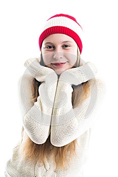 Happiness winter holidays christmas. Teenager concept - smiling young woman in red hat, scarf and over white background.