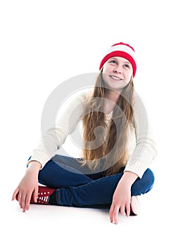 Happiness winter holidays christmas. Teenager concept - smiling young woman in red hat, scarf and over white background.