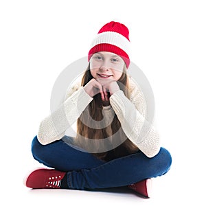 Happiness winter holidays christmas. Teenager concept - smiling young woman in red hat, scarf and over white background.