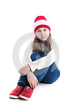 Happiness winter holidays christmas. Teenager concept - smiling young woman in red hat, scarf and over white background.