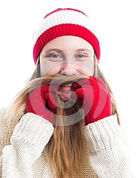 Happiness winter holidays christmas. Teenager concept - smiling young woman in red hat, scarf and over white background.