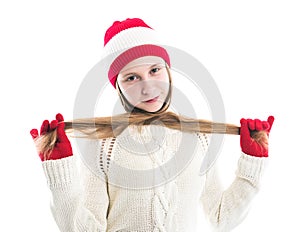 Happiness winter holidays christmas. Teenager concept - smiling young woman in red hat, scarf and over white background.