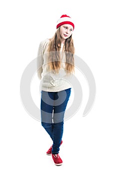 Happiness winter holidays christmas. Teenager concept - smiling young woman in red hat, scarf and over white background.