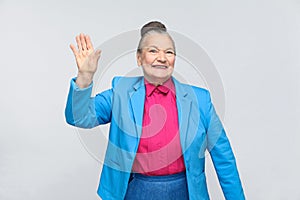 Happiness woman showing hi sign and toothy smiling