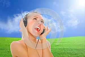 Happiness women in headphones and listening music