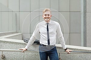 Happiness young adult success businessman, looking at camera and toothy smile.