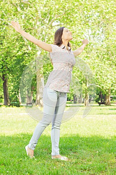 Happiness young woman enjoyment in the nature