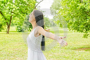 Happiness young woman enjoyment in the nature photo