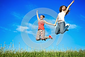 Happiness young women jumping