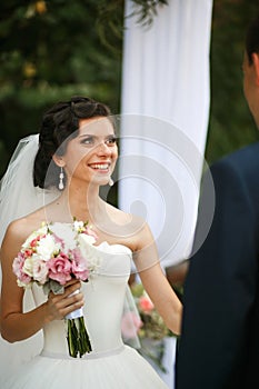 The happinest bride with bouquet