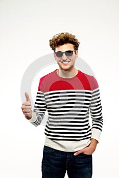 Happpy man in sunglasses with thumb up