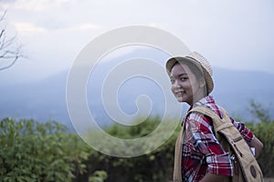 Happpy yoing girl at beautiful view point at Phu Pa Po Loei Thailand