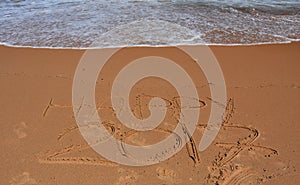 Happy 2017 lettering on the beach.