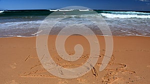 Happy 2017 lettering on the beach.