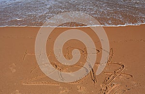 Happy 2017 lettering on the beach.