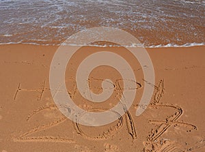 Happy 2017 lettering on the beach.